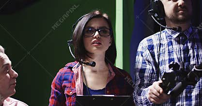 Female producer or prompt wearing a headset