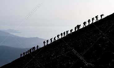 Mountaineers hiking uphill