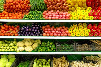 Fresh organic Vegetables and fruits on shelf in supermarket, farmers market. Healthy food concept. Vitamins and minerals. Tomatoes