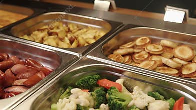 Delicious hot meals are on a buffet lunch in a hotel, top panorama
