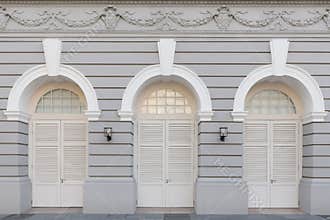 Three arched doors in historic buildings