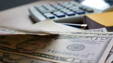 Money falling on an office table. Finance and savings concept.