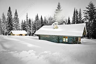 Log cabin in snow