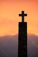 Cross silhouette at sunset time