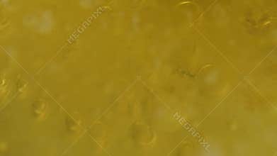 Abstract close-up on the surface of boiling water and oil