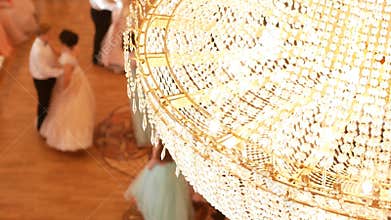 Couples dancing waltz in the vintage ball costumes