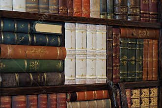 Old classic books on bookshelf