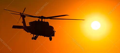 H-60 helicopter at sunset