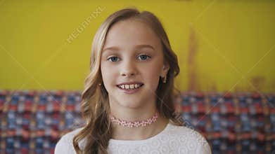 Portrait of happy young girl smiling at camera. 4K