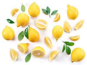 Ripe lemons and lemon leaves on white background. Top view.