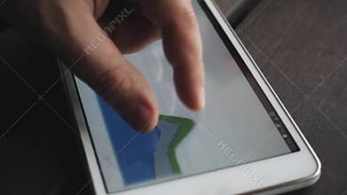 Analyst looking through digital financial reports. Closeup