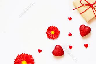 A gift on a white background with decorations. The concept of the St. Valentine`s day, weddings, birthday and other