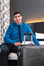 Businessman at arrival in hotel room