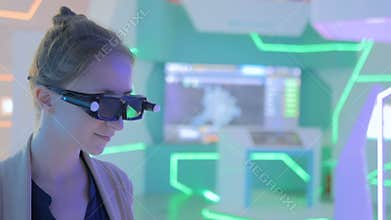 Young woman using 3d augmented reality glasses