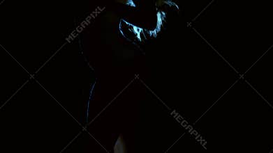 Sexual tender woman takes off her silk robe with motion.