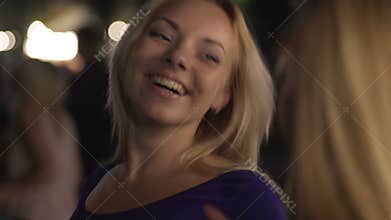 Beautiful homosexual women exchanging seductive looks at bar, flirting at party