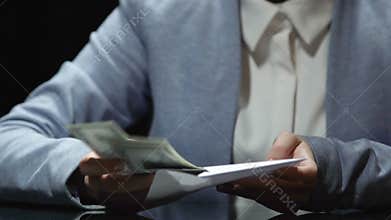 Lady journalist receiving cash envelope from politician for writing fake article