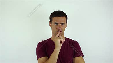 Handsome young man actively thinks about the problem.