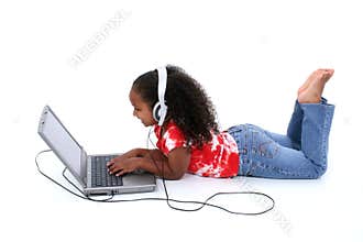 Adorable Six Year Old Girl Sitting On Floor With Laptop Computer