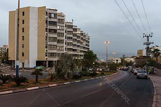 EILAT, ISRAEL - March 28, 2018: Night city street and appartment building.