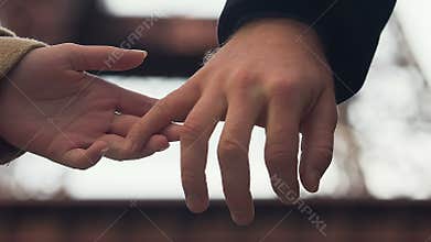 Female hand let off man hand, woman break up with boyfriend, unshared feelings