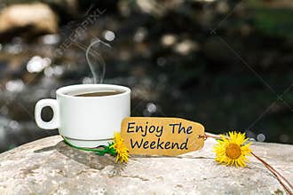 Enjoy the weekend text with coffee cup