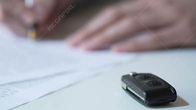 Insurance company employee signing car rental contract, affordable vehicle