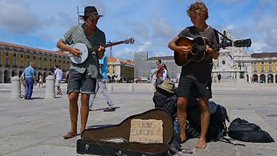 Street musicians playing in middle of Commerce Square, amusing passers-by