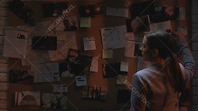 Woman detective searching terrorist act connections, figuring out danger place