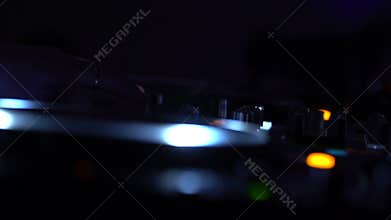 Dj mixing music on turntable in night club, entertainment work, having fun party