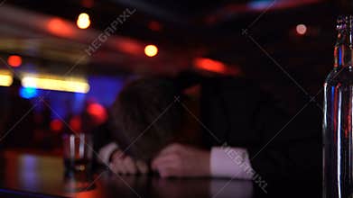 Drunk man lying unconscious in bar, fighting problems alone, middle age crisis