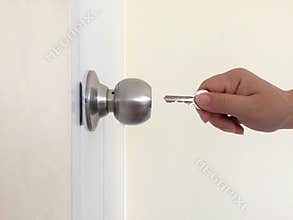 Open the door with a key.