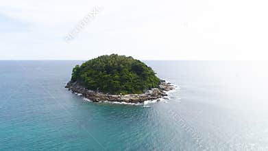 Aerial drone shot of Ko Pu desert island with palm trees and wild nature surrounded by turquoise sea water in Phuket, Thailand