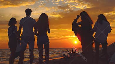 Beach party dancing. Slow-motion shooting.