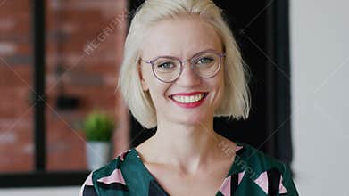 Cheerful elegant lady at home
