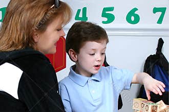 Mother Droping Son Off At Preschool