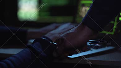 Cyber police catching and arresting hacker during committing cybercrime, justice