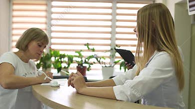 The patient fill form at reception of clinic