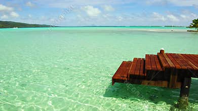 Pier in sea at tropical beach in french polynesia