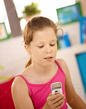 Schoolgirl using cellphone