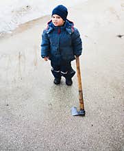 Strange child holding axe