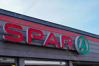 Spar tree logo and round sign on supermarket wall facade retailer chain