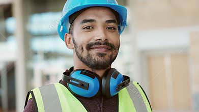 Happy mixed race construction site worker looking at camera