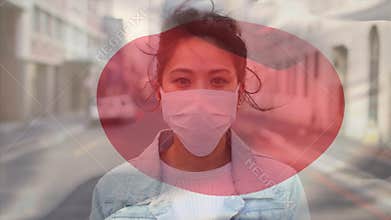 Animation of flag of japan waving over woman wearing face mask during covid 19 pandemic