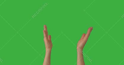 Woman clapping her hands over green screen