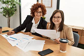 Group of two women working at the office