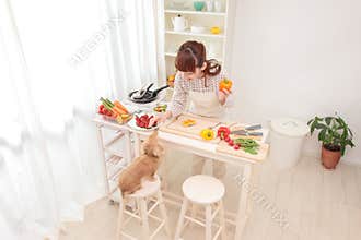 Woman cooking in kitchen
