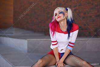 Cosplayer girl with in Harley Quinn costume