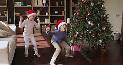 Overjoyed preteen children jump laugh go crazy celebrate New Year