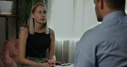 Psychotherapy - psychotherapist or psychiatrist conducting counselling with young woman. mental health disorder